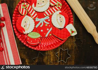 Beautiful cookies for Christmas in red on a wooden background