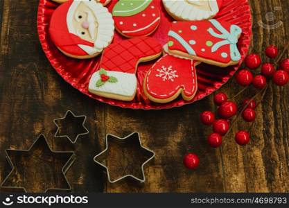 Beautiful cookies for Christmas in red on a wooden background