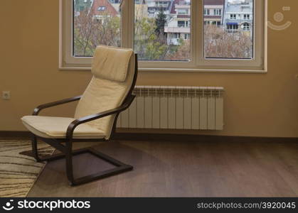 Beautiful corner in small living room with chair, Sofia, Bulgaria