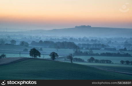 Beautiful countryside foggy sunrise landscape with layersof fog