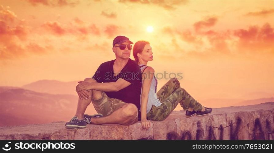 Beautiful couple enjoying sunset, married couple on a date outdoors, romantic relationships, happy family traveling together in the summer