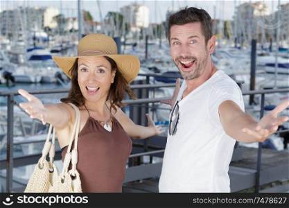 beautiful couple in love traveling in a sea port