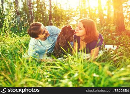 Beautiful couple with dog outdoors