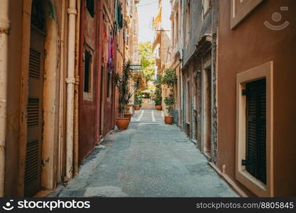 Beautiful cozy narrow street in old town of Italy or Greece. Historic european facades of buildings. Cityscape concept. High quality photo. Beautiful cozy narrow street in old town of Italy or Greece. Historic european facades of buildings. Cityscape concept.