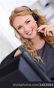 Beautiful customer-service woman with headset on