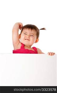 Beautiful cute baby infant with muscle arm expressing power strength and frowning face holding white board, isolated.