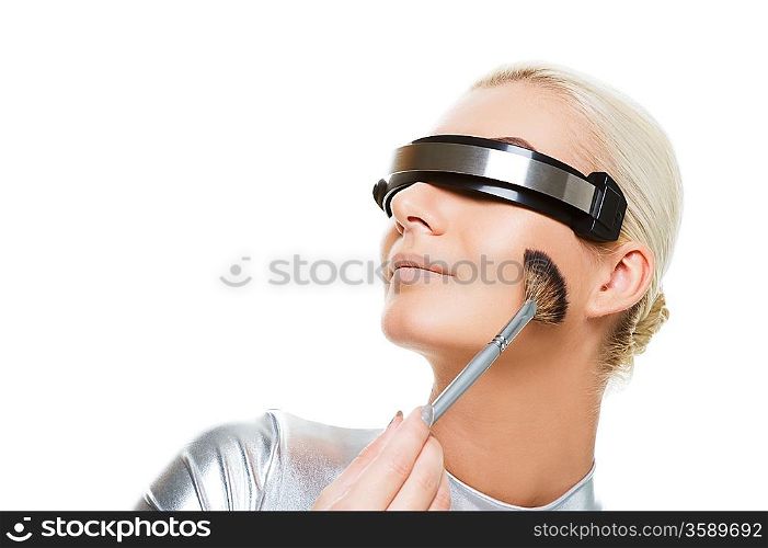 Beautiful cyber woman applying make-up