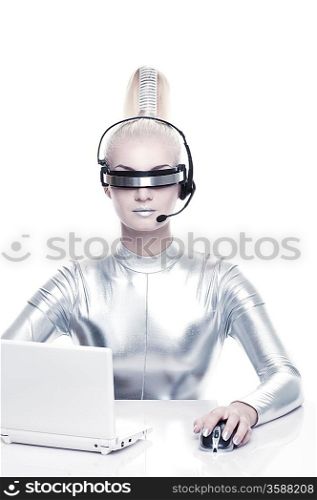 Beautiful cyber woman working on her laprop