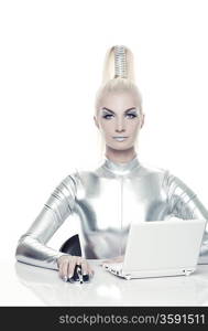 Beautiful cyber woman working on her laptop