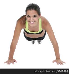 Beautiful dark haired tan teen girl in workout clothes over white doing pushup.