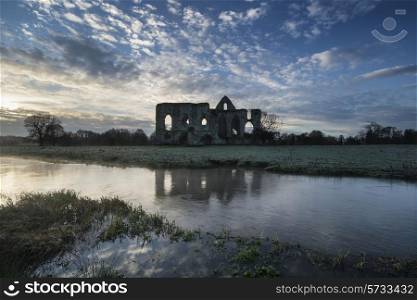 Beautiful dawn landscape of Priory ruins in countryside location