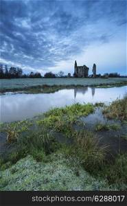 Beautiful dawn landscape of Priory ruins in countryside location