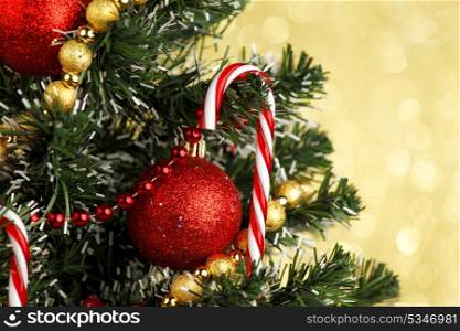 Beautiful decorated Christmas tree on glitter background