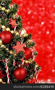 Beautiful decorated christmas tree on red background