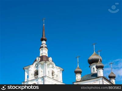 Beautiful dome and spire of the Spaso-Preobrazhensky Solovetsky monastery against the blue sky.