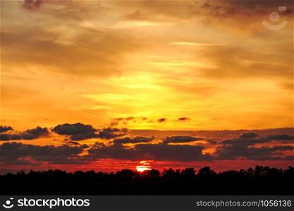 Beautiful dramatic sunset with twilight color sky and clouds