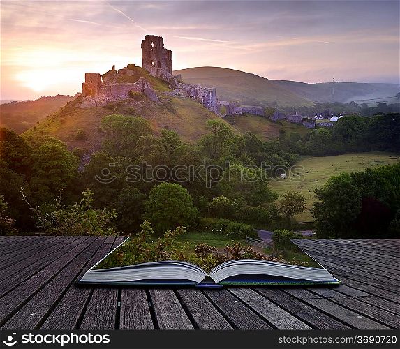 Beautiful dreamy fairytale castle ruins against romantic colorful sunrise coming out of pages in magical book creative concept