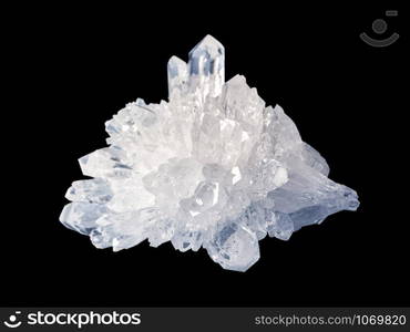 Beautiful druse of transparent crystals of rock crystal, isolated on a black background, close-up. Rock crystal is a semiprecious variety of quartz mineral. Collectible specimen