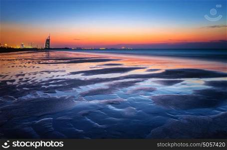 Beautiful Dubai beach in sunset light, gorgeous landscape, majestic night view on a luxury modern city, travel and tourism concept, United Arab Emirates