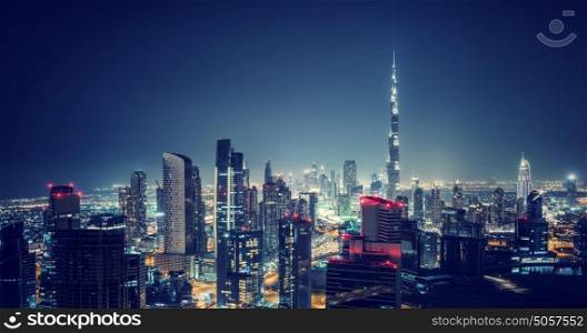 Beautiful Dubai cityscape, bird's eye view on a night urban scene, modern city panoramic landscape, United Arab Emirates