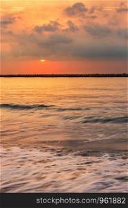 Beautiful early morning sunrise over the sea the horizon at Hat Chao Samran beach in Phetchaburi Thailand.