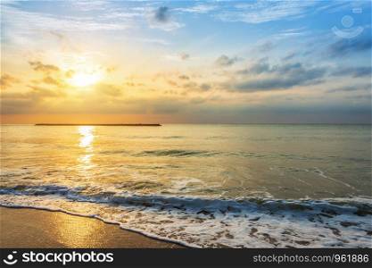 Beautiful early morning sunrise over the sea the horizon at Hat Chao Samran beach in Phetchaburi Thailand.