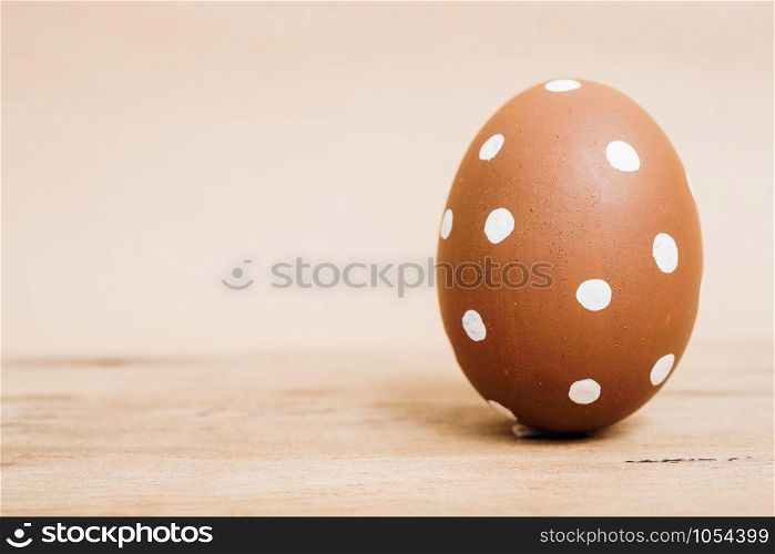 Beautiful Easter Brown egg on wooden background, Easter day concept