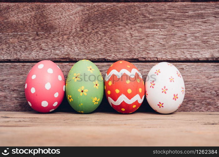 Beautiful Easter egg on wooden background, Easter day concept