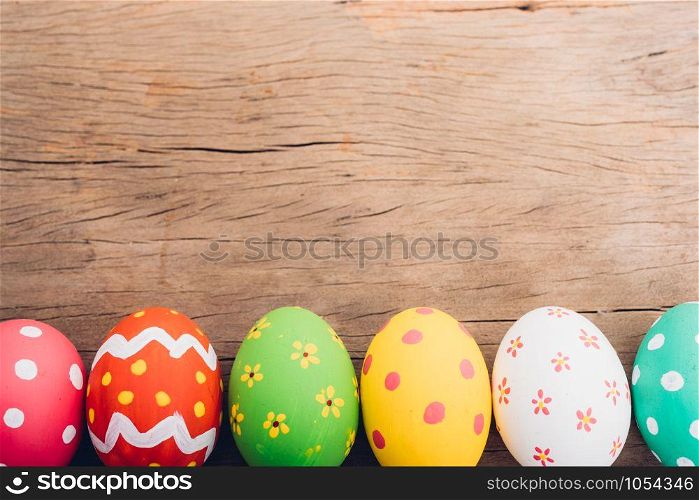 Beautiful Easter multi color egg on wooden background, Easter day concept