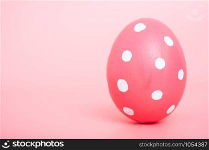 Beautiful Easter Pink egg color on pink background, Easter day concept