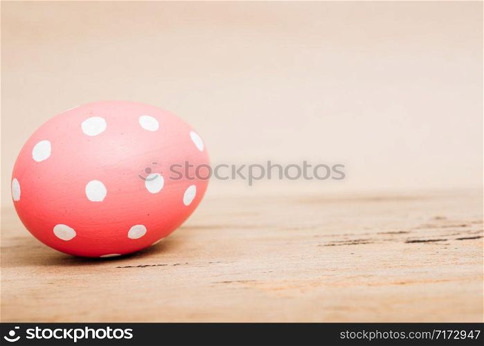 Beautiful Easter Pink egg on wooden background, Easter day concept
