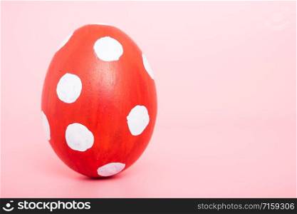Beautiful Easter Red egg color on pink background, Easter day concept