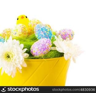 Beautiful Easter still life isolated on white background, colorful eggs decorated with flowers in yellow basket, cute chick