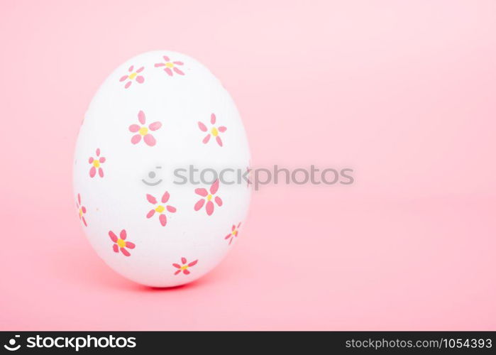 Beautiful Easter White egg color on pink background, Easter day concept