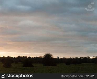 beautiful empty landscape background clouds autumn grass field meadow; essex; england; uk