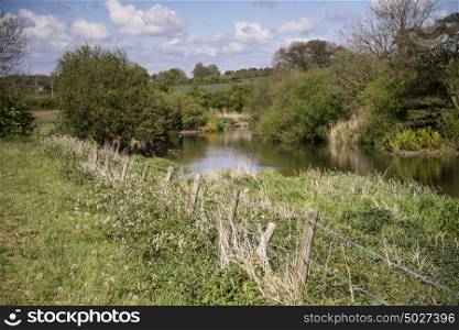 Beautiful English countryside river landscape with shallow depth of field