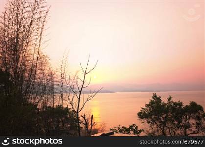 Beautiful environment of beautiful sunset on Khuean Srinagarindra National Park at Kanchanaburi , Thailand and sky for travel in holiday relax time