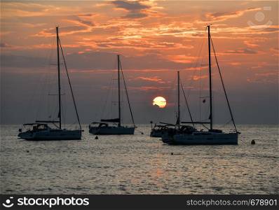 Beautiful evening Adriatic sea, yachts and sunset sky, Croatia. Evening seascape.