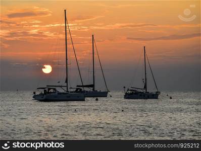 Beautiful evening Adriatic sea, yachts and sunset sky, Croatia. Evening seascape.