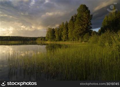Beautiful evening at lake Delsbo near the Swedish town Jarvso. Evening at lake Delsbo