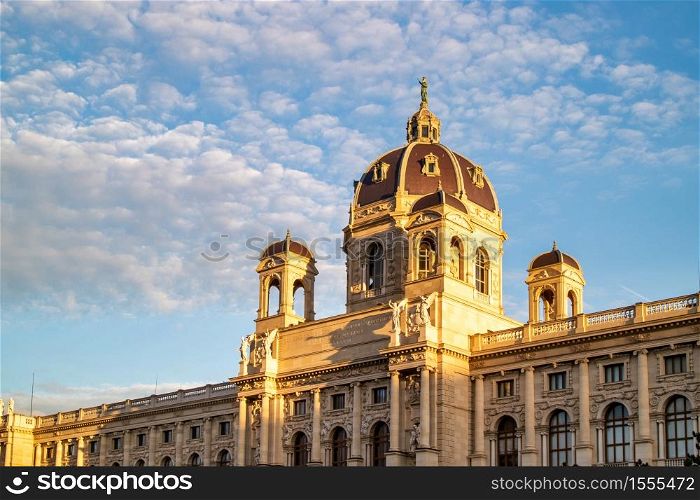 Beautiful facade of the Kunsthistorisches Museum or Art museum on a background of blue cloudy sky in Vienna, Austria.. Ancient building of Museum of Fine Arts in Vienna, Austria.