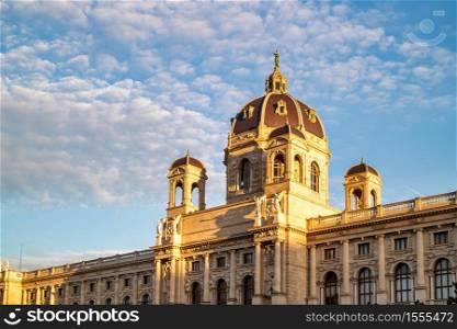 Beautiful facade of the Kunsthistorisches Museum or Art museum on a background of blue cloudy sky in Vienna, Austria.. Ancient building of Museum of Fine Arts in Vienna, Austria.