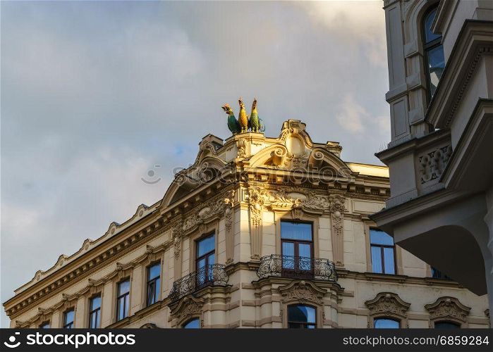 "Beautiful facades of the historical building in Brno with "three gallos" ."