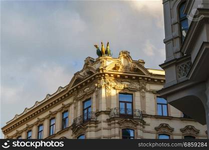 "Beautiful facades of the historical building in Brno with "three gallos" ."