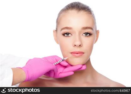 Beautiful face lip filler collagen injection Cosmetic spa beauty treatment with pink gloves, on white.