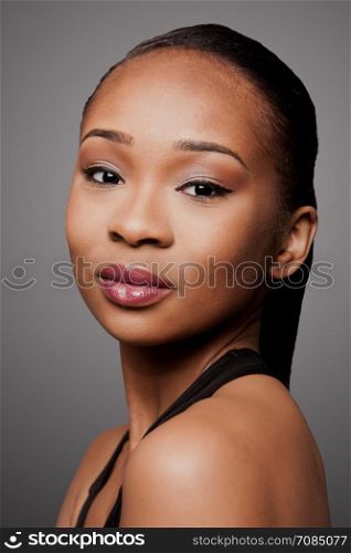 Beautiful face of black Asian blasian woman with cosmetics makeup.