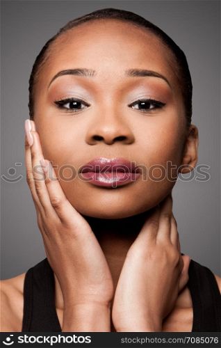Beautiful face of black Asian blasian woman with cosmetics makeup, skincare concept.