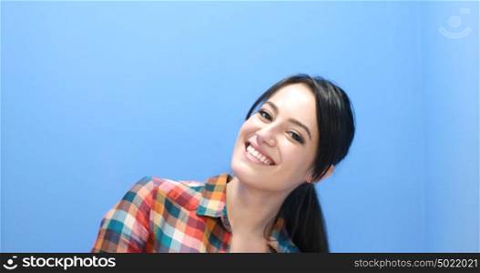 Beautiful face of young adult woman with clean fresh skin - studio portrait