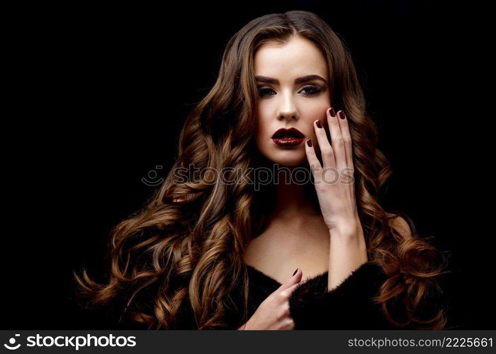 Beautiful Face of Young Woman with Clean Fresh Skin and healthy curly hair close up on black background. Beautiful Woman with Clean Fresh Skin and healthy curly hair