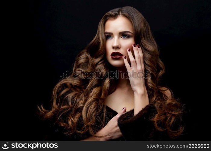 Beautiful Face of Young Woman with Clean Fresh Skin and healthy curly hair close up on black background. Beautiful Woman with Clean Fresh Skin and healthy curly hair